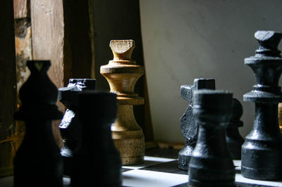 A game of chess made of wood with white chess attacked by black chess