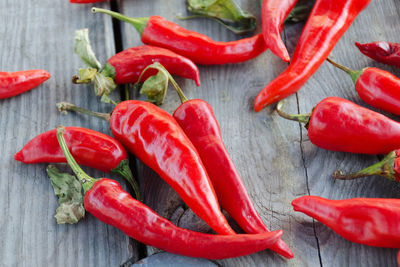 Close-up of red chili peppers on table