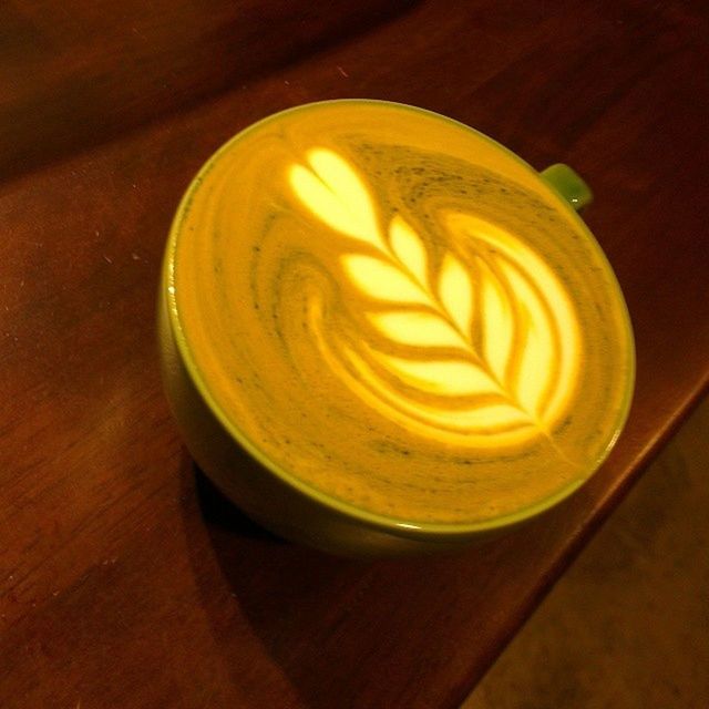 indoors, food and drink, table, drink, refreshment, still life, freshness, coffee cup, frothy drink, high angle view, cappuccino, froth art, close-up, wood - material, coffee - drink, art, saucer, directly above, creativity, coffee