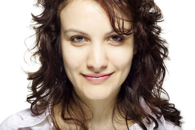 Portrait of smiling woman against white background