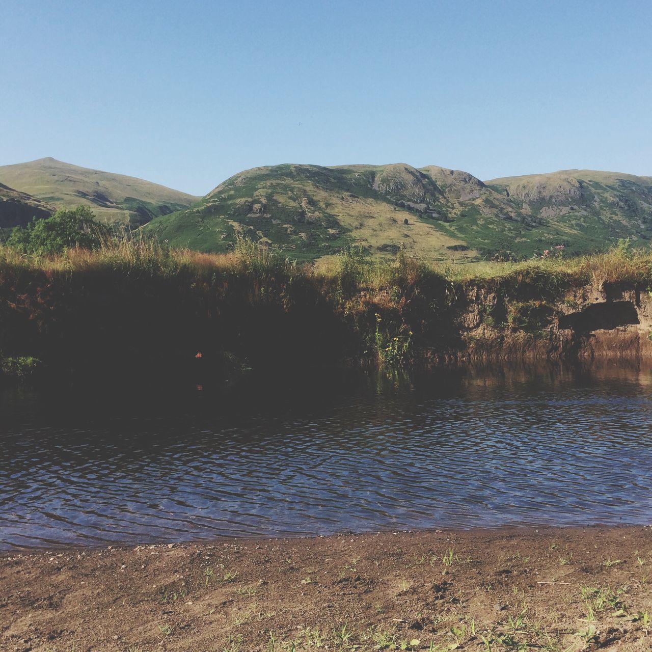 clear sky, mountain, water, tranquil scene, tranquility, scenics, beauty in nature, lake, copy space, blue, nature, tree, mountain range, landscape, river, idyllic, non-urban scene, day, plant, growth