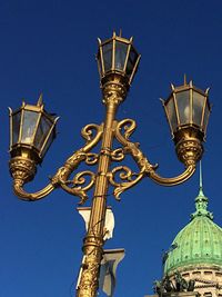 Low angle view of building against blue sky