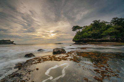 Scenic view of sea against sky during sunset