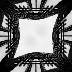 Low angle view of rollercoaster against sky