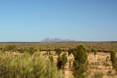 Scenic view of land against clear blue sky