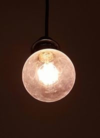 Low angle view of lit light bulb