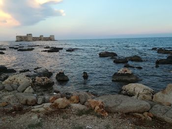 Scenic view of sea against sky during sunset