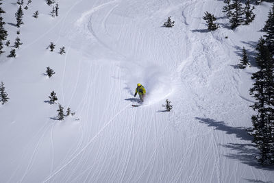 High angle view of person skiing on snowcapped mountain