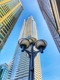 Low angle view of buildings against clear blue sky