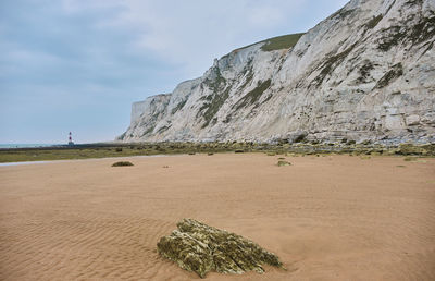 Beachy head lighthouse, seven sisters chalk cliffs at low tide near eastbourne, east sussex, uk