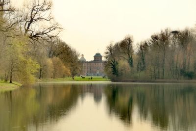 Reflection of trees in lake against sky