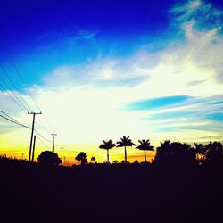 Silhouette of landscape against sky at sunset
