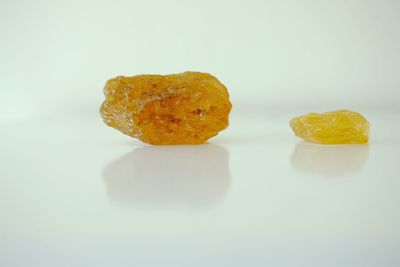 Close-up of fruit over white background