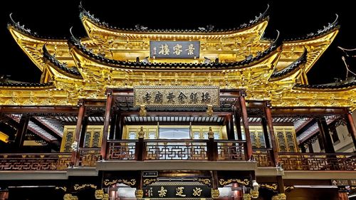 Low angle view of illuminated temple building