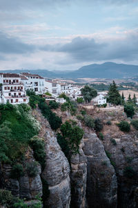 Scenic view of buildings in city against sky