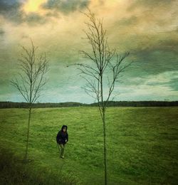 People walking on grassy field