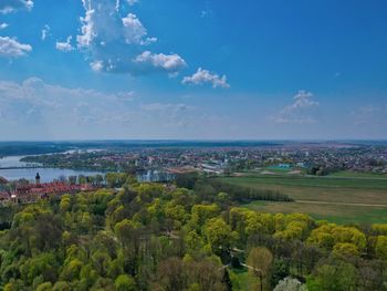 Scenic view of sea and cityscape against sky