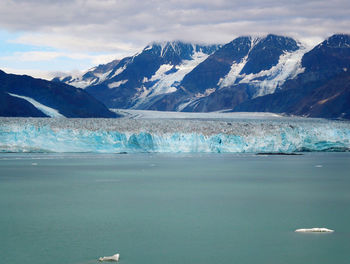 Frozen lake with mountains in background