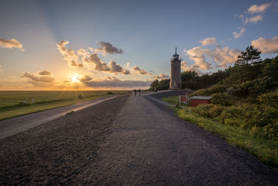 Road against sky at sunset