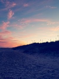 Scenic view of field against sky during sunset