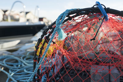 Close-up of fishing net hanging on rope