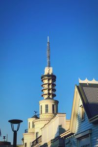 Low angle view of buildings against blue sky