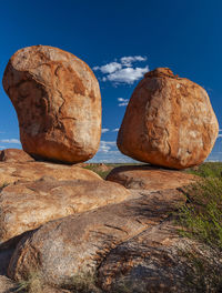 Low angle view of rock formation against blue sky