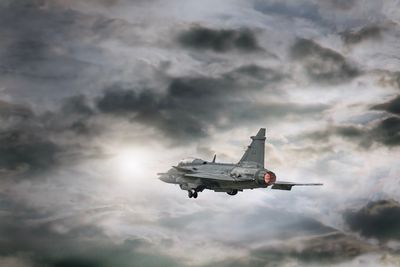 Low angle view of airplane flying in sky