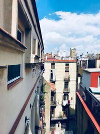 Street amidst buildings against sky