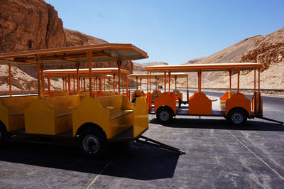 View of vehicles on road against mountain