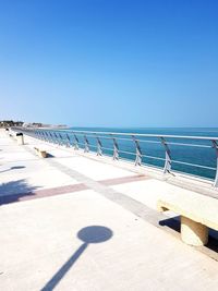 Scenic view of swimming pool against clear blue sky