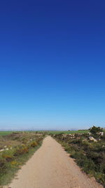 Empty country road along landscape