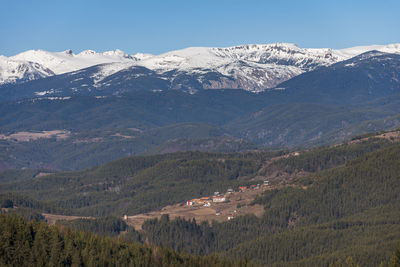 Scenic view of snowcapped mountains against sky