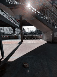 Low angle view of bridge and buildings in city
