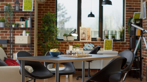 Empty chairs and tables in cafe