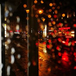 Defocused image of illuminated city at night