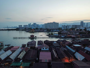 High angle view of buildings against sky at sunset