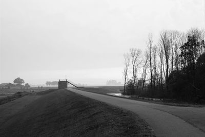 Empty country road along landscape