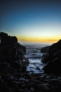 Scenic view of sea against sky during sunset