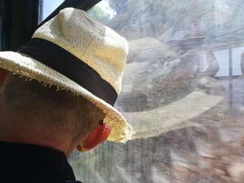 Rear view of man in hat