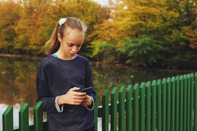 Teenage girl using mobile phone