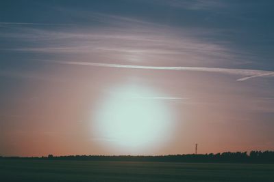 Scenic view of field against sky during sunset