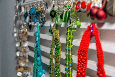 Close-up of decorations hanging for sale in market