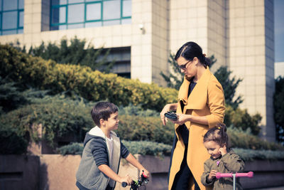 Mother with children on sunny day