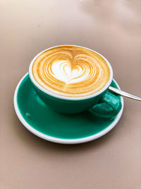 Coffee with milk foam in heart shape