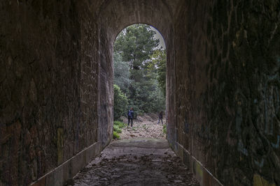 People walking in tunnel