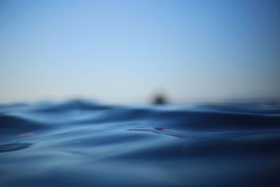 Close-up of rippled water against clear blue sky