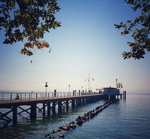 Pier over sea against clear sky