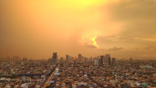 Cityscape against sky during sunset