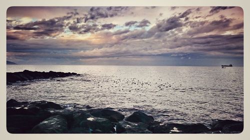 Scenic view of sea against sky during sunset